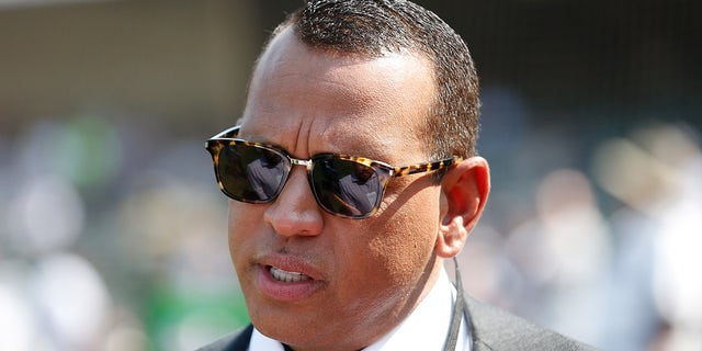 Broadcaster and former MLB player Alex Rodriguez watches from the field before the game between the Oakland Athletics and the New York Yankees at the RingCentral Coliseum on August 29, 2021 in Oakland, Calif.