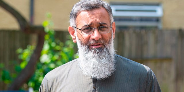 Anjem Choudary. Amends spelling of Choudary in filename. Radical preacher Anjem Choudary speaks to the media in Ilford, east London, after restrictions on him speaking in public following his release from prison came to an end. Picture date: Monday July 19, 2021. The extremist was jailed five years ago after being convicted of inviting support for the Islamic State terror group, and he left Belmarsh high-security jail on licence in 2018. Photo credit should read: Dominic Lipinski/PA Wire URN:61031998 (Press Association via AP Images)