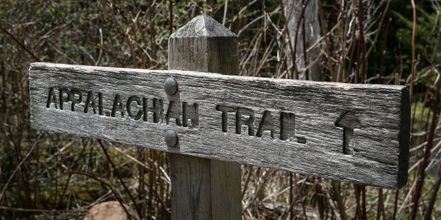 A trail sign at Clingmans Dome, a major scenic viewing point along the Appalachian Trail, on May 11, 2018, near Cherokee, North Carolina. The Great Smoky Mountains National Park straddles the Tennessee and North Carolina borders in the heart of the Appalachian Mountain Range.