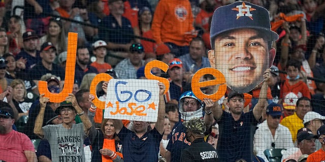 Spectators cheer for Houston Astros second baseman Jose Altuve during the first inning in Game 1 of a baseball American League Division Series between the Houston Astros and the Chicago White Sox Thursday, Oct. 7, 2021, in Houston.