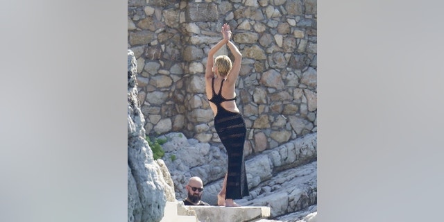 Sharon Stone shows off a dress during a photo shoot in France.