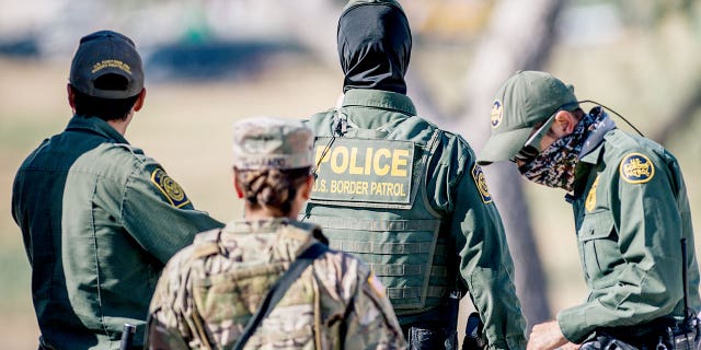 Border Patrol agents and members of the National Guard patrol a checkpoint entry near the Del Rio International Bridge on September 22, 2021 in Del Rio, Texas. Thousands of immigrants, mostly from Haiti, seeking asylum have crossed the Rio Grande into the United States. Families are living in makeshift tents under the international bridge while waiting to be processed into the system. U.S. immigration authorities have been deporting planeloads migrants directly to Haiti while others have crossed the Rio Grande back into Mexico.