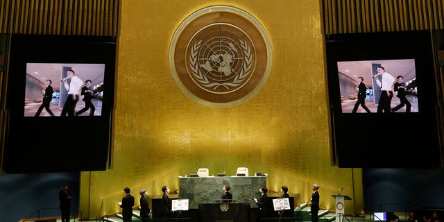 Members of South Korean K-pop band BTS watch a music video on the General Assembly Hall monitors during a meeting on Sustainable Development Goals at the 76th session of the U.N. General Assembly at U.N. headquarters on Monday, Sept. 20, 2021. (John Angelillo/Pool Photo via AP)