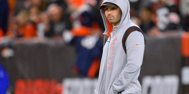 Cleveland Browns quarterback Baker Mayfield watches players warm up for an NFL football game against the Denver Broncos, Thursday, Oct. 21, 2021, in Cleveland.