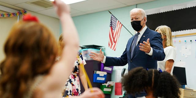 President Biden talks to students during a visit to East End Elementary School to promote his "Build Back Better" agenda, Monday, Oct. 25, 2021, in North Plainfield, New Jersey. (AP Photo/Evan Vucci)