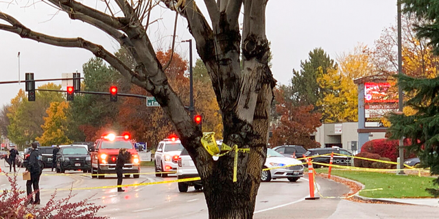 Police close off a street outside a shopping mall after a shooting in Boise, Idaho on Monday, Oct. 25, 2021. Police said there are reports of multiple injuries and one person is in custody.