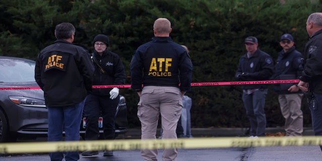 Law enforcement officers collect evidence near the scene of a shooting at the Boise Towne Square shopping mall in Boise, Idaho, on Monday.