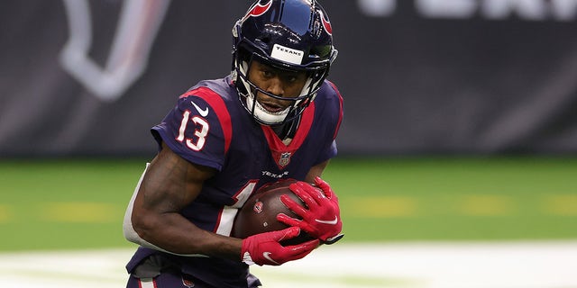 Brandin Cooks #13 of the Houston Texans catches a pass for a touchdown during the second half of a game against the Tennessee Titans at NRG Stadium on January 03, 2021 in Houston, Texas.