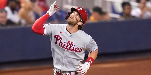 Bryce Harper of the Philadelphia Phillies goes around the bases after scoring a solo home run in the fifth inning of a baseball game against the Miami Marlins on Friday, October 18. 1, 2021, in Miami.