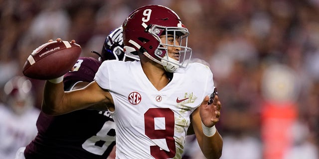 Alabama quarterback Bryce Young is pressured by Texas A&amp;M defensive lineman DeMarvin Leal on Oct. 9, 2021, in College Station, Texas.