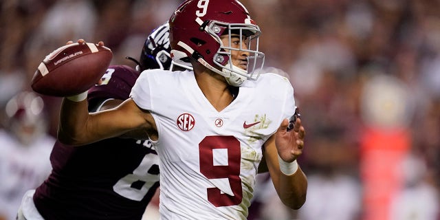 Alabama quarterback Bryce Young (9) takes pressure from Texas A&M defensive lineman DeMarvin Leal (8) during the first half of an NCAA college football game on Saturday October 9, 2021 at College Station, Texas.