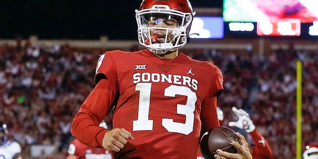 Oklahoma quarterback Caleb Williams (13) runs in for a touchdown during the second half of an NCAA college football game against TCU, Saturday, Oct. 16, 2021, in Norman, Okla.