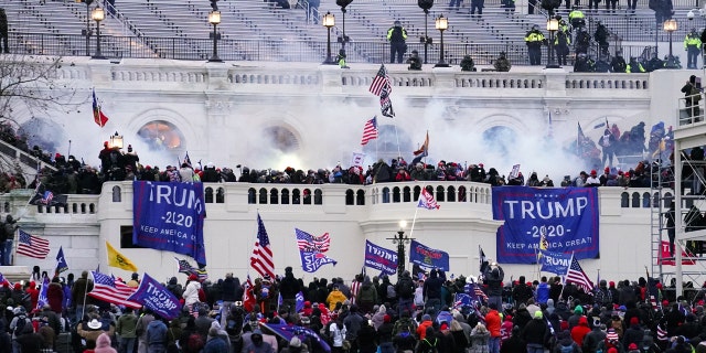 In this Jan. 6, 2021 file photo, protesters storm the Capitol in Washington. (AP Photo/John Minchillo)