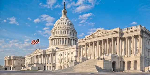 The east side of the US Capitol in the early morning. Senate Chamber in the foreground.