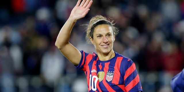 United States forward Carli Lloyd waves to fans after a soccer friendly match against South Korea, Tuesday, Oct. 26, 2021, in St. Paul, Minnesota.