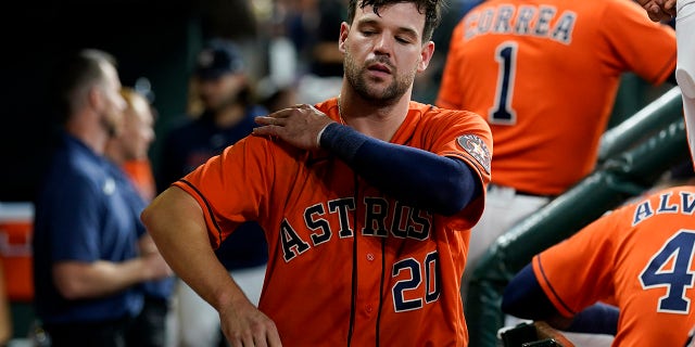 Houston Astros' Chas McCormick walks in the dugout after striking out against the Boston Red Sox during the seventh inning in Game 2 of the American League Championship Series Saturday, Oct. 16, 2021, in Houston.