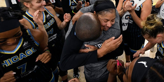 Chicago Sky's Candice Parker, coach James Wade and teammates celebrate after defeating the Connecticut Sun 79-69 in Game 4 of a WNBA basketball semifinal series Wednesday, Oct. 6, 2021, in Chicago.