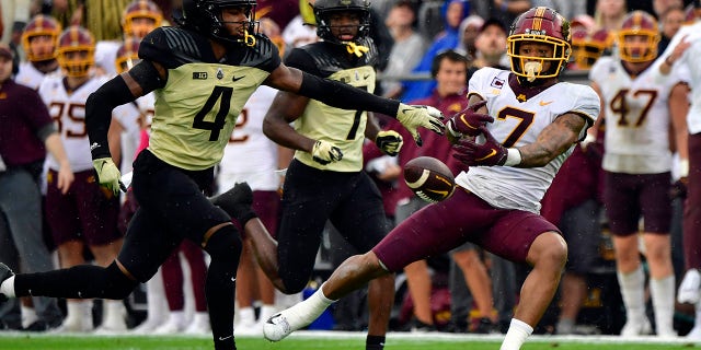 Minnesota Golden Gophers wide receiver Chris Autman-Bell (7) misses a pass in front of Purdue Boilermakers safety Marvin Grant (4) during the second quarter at Ross-Ade Stadium.
