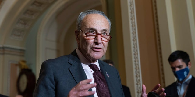 Senate Majority Leader Chuck Schumer speaks to the media after a Democratic policy luncheon, Oct. 19, 2021, on Capitol Hill.