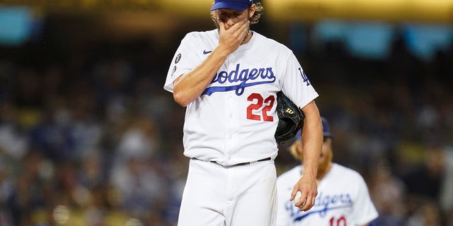 Los Angeles Dodgers starting pitcher Clayton Kershaw (22) reacts on the mound before he exits the game during the second inning of a baseball game against the Milwaukee Brewers Friday, Oct. 1, 2021, in Los Angeles.