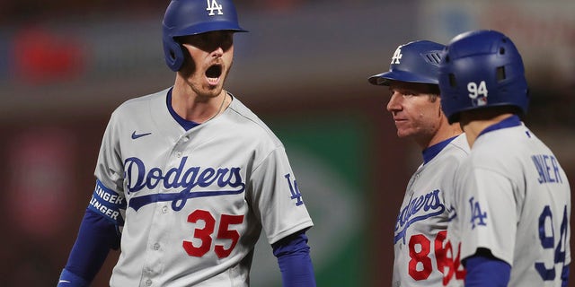 Los Angeles Dodgers' Cody Bellinger (35) reacts after hitting an RBI-single against the San Francisco Giants during the ninth inning of Game 5 of a baseball National League Division Series Thursday, Oct. 14, 2021, in San Francisco.