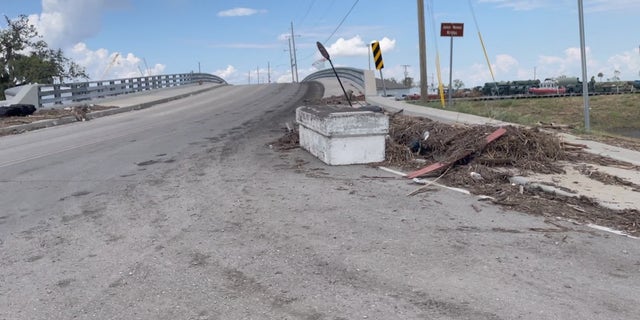 A coffin displaced after Hurricane Ida sits on the road outside Jean Lafitte, Louisiana.