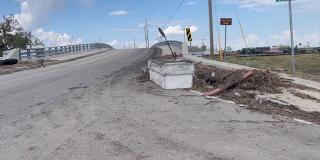 A coffin displaced after Hurricane Ida sits on the road outside Jean Lafitte, Louisiana.