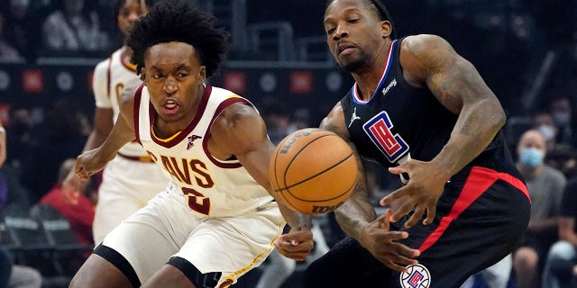 Cleveland Cavaliers guard Collin Sexton, left, steals the ball from Los Angeles Clippers guard Eric Bledsoe during the first half of an NBA basketball game Wednesday, Oct. 27, 2021, in Los Angeles.