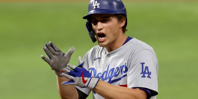 Corey Seager #5 of the Los Angeles Dodgers celebrates after hitting an RBI single against the Tampa Bay Rays during the first inning in Game Five of the 2020 MLB World Series at Globe Life Field on Oct. 25, 2020 in Arlington, Texas.