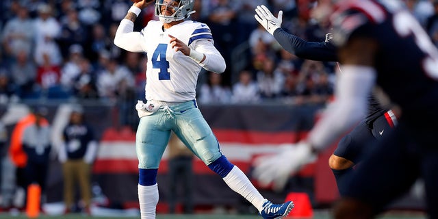 Dallas Cowboys quarterback Dak Prescott (4) throws a pass during the first half of an NFL football game against the New England Patriots, Sunday, Oct. 17, 2021, in Foxborough, Mass.