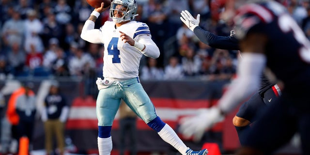 Dallas Cowboys quarterback Dak Prescott (4) throws a pass during the first half of an NFL football game against the New England Patriots, Sunday, Oct. 17, 2021, in Foxborough, Mass.