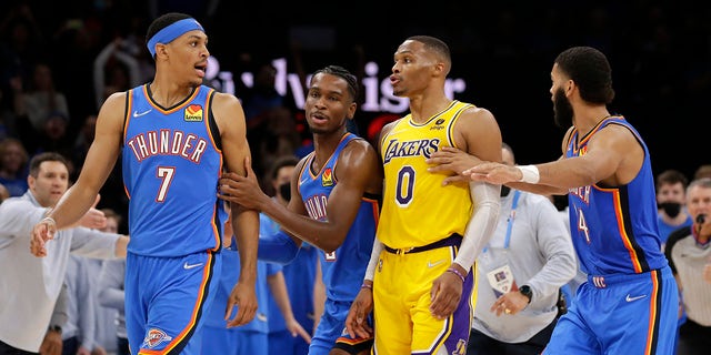 Oklahoma City Thunder guard Josh Giddey (3) and forward Kenrich Williams (34) break up Oklahoma City Thunder forward Darius Bazley (7) and Los Angeles Lakers guard Russell Westbrook (0) during the second half of an NBA basketball game, Wednesday, Oct. 27, 2021, in Oklahoma City.