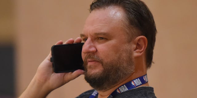 Daryl Morey, GM of the Houston Rockets, talks on the phone during practice as part of the NBA Restart 2020 on July 23, 2020 in Orlando, Florida.