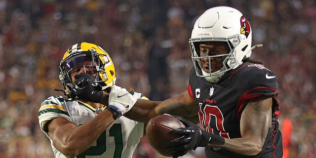 DeAndre Hopkins #10 of the Arizona Cardinals is called for a personal foul penalty against Eric Stokes #21 of the Green Bay Packers during the first half at State Farm Stadium on Oct. 28, 2021 in Glendale, Arizona.