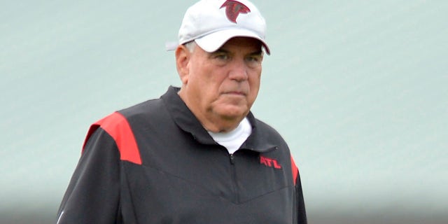 FLOWERY BRANCH, GA - JULY 30: Defensive Coordinator Dean Pees of the Atlanta Falcons watches training camp at IBM Performance Field on July 30, 2021 in Flowery Branch, Georgia. 