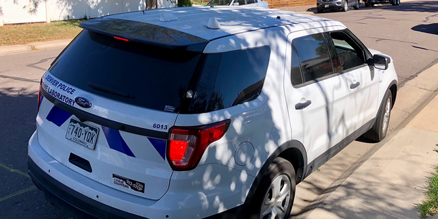 A Denver police car on the scene.