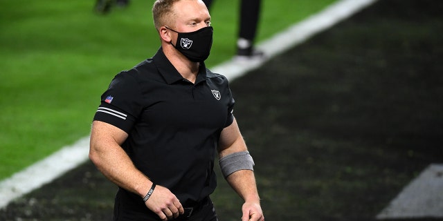 LAS VEGAS, NEVADA - DECEMBER 17: Strength and conditioning assistant Deuce Gruden of the Las Vegas Raiders, son of head coach Jon Gruden, looks on as the team warms up before a game against the Los Angeles Chargers at Allegiant Stadium on December 17, 2020 in Las Vegas, Nevada. The Chargers defeated the Raiders 30-27 in overtime. (Photo by Ethan Miller/Getty Images)