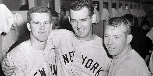 Yankee heroes congratulate each other in the dressing room after the Bombers routed the Milwaukee Braves 12-3 in the third World Series game on Oct. 5, 1957. From left are Milwaukee-born Tony Kubek, who hit two homers, Don Larsen, the winning pitcher and Mickey Mantle, who connected with a long homer in the fourth inning. 