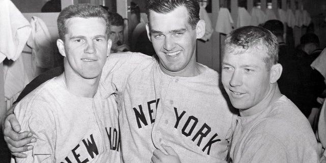 Yankee heroes congratulate each other in the dressing room after the Bombers routed the Milwaukee Braves 12-3 in the third World Series game on Oct. 5, 1957. From left are Milwaukee-born Tony Kubek, who hit two homers, Don Larsen, the winning pitcher and Mickey Mantle, who connected with a long homer in the fourth inning.