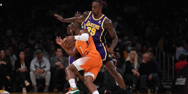 Oct 22, 2021; Los Angeles, California, USA; Phoenix Suns guard Chris Paul (3) is defended by Los Angeles Lakers center Dwight Howard (39) in the first half at Staples Center.