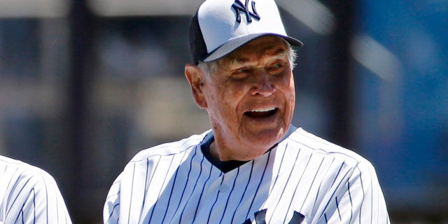 FILE - In this June 12, 2016, file photo, former New York Yankees player Eddie Robinson smiles before the Yankees annual Old Timers Day baseball game, in New York. Former big leaguer and general manager Eddie Robinson, who was the oldest living former MLB player, has died at age 100. The Texas Rangers, the team for which Robinson was GM from 1976-82, said he passed away Monday night, Oct. 4, 2021 at his ranch in Bastrop, Texas.