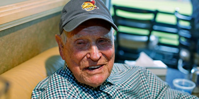 FILE - In this Tuesday, Nov. 1, 2016 file photo, Eddie Robinson sits in a box at Progressive Field before Game 6 of the Major League Baseball World Series against the Chicago Cubs in Cleveland. Former big leaguer and general manager Eddie Robinson, who was the oldest living former MLB player, has died at age 100. The Texas Rangers, the team for which Robinson was GM from 1976-82, said he passed away Monday night, Oct. 4, 2021 at his ranch in Bastrop, Texas.
