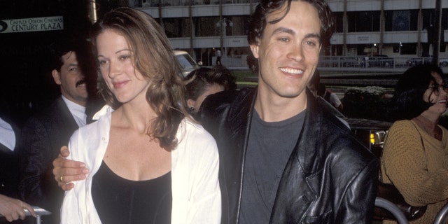 Actress Brandon Lee and girlfriend Eliza Hutton are attending the premiere of 'Alien 3'.