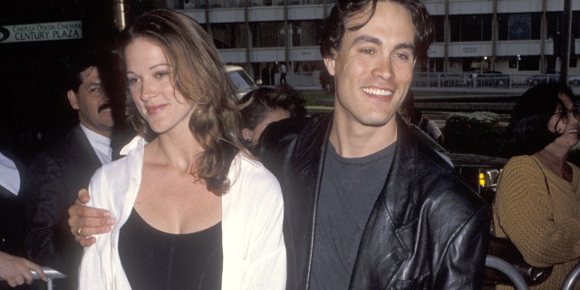 Actor Brandon Lee and girlfriend Eliza Hutton attend the 'Alien 3' premiere.