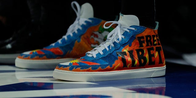 Detail of the shoes worn by Enes Kanter #13 of the Boston Celtics with the wording