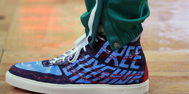 The shoes of Enes Kanter of the Boston Celtics before the Celtics' home opener against the Toronto Raptors at TD Garden on Oct. 22, 2021 in Boston.