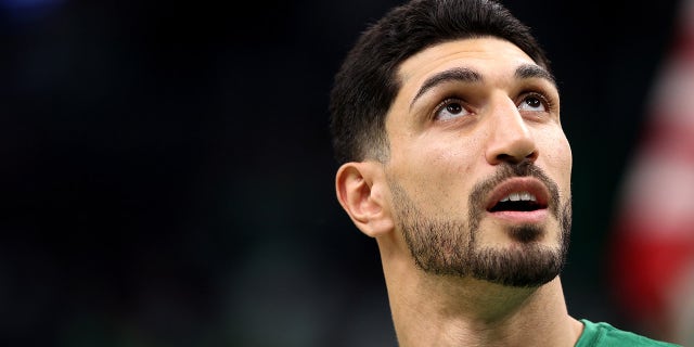 BOSTON, MASSACHUSETTS - OCTOBER 22: Enes Kanter #13 of the Boston Celtics looks on before during the Celtics home opener against the Toronto Raptors at TD Garden on October 22, 2021 in Boston, Massachusetts.