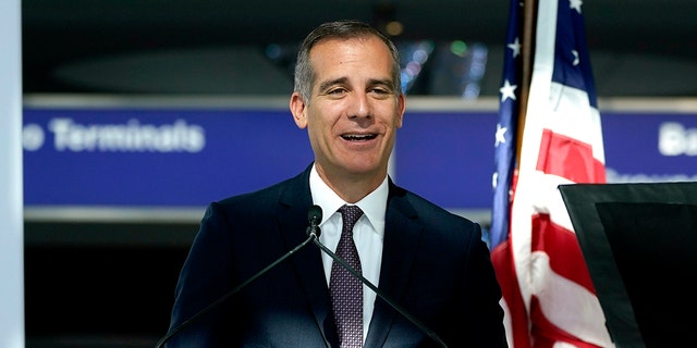 Los Angeles Mayor Eric Garcetti gives a press conference at the new West Gates of the Tom Bradley International Terminal at Los Angeles International Airport, Monday, May 24, 2021. (AP Photo/Ashley Landis)