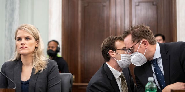 WASHINGTON, DC - OCTOBER 05: Aides confer as former Facebook employee Frances Haugen listens to opening statements during a Senate Committee on Commerce, Science, and Transportation hearing entitled 'Protecting Kids Online: Testimony from a Facebook Whistleblower' on Capitol Hill October 5, 2021 in Washington, DC. Haugen left Facebook in May and provided internal company documents about Facebook to journalists and others, alleging that Facebook consistently chooses profit over safety. (Photo by Drew Angerer/Getty Images)
