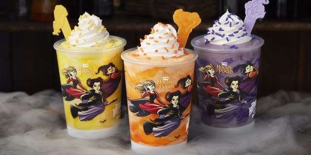 Carvel's "Hocus Pocus" milkshake trio includes Sarah’s Chilling Churro Shake (yellow), Winnie's Glorious Cake Batter Shake (orange) and Mary’s Divine Cookies & Cream Shake (purple).